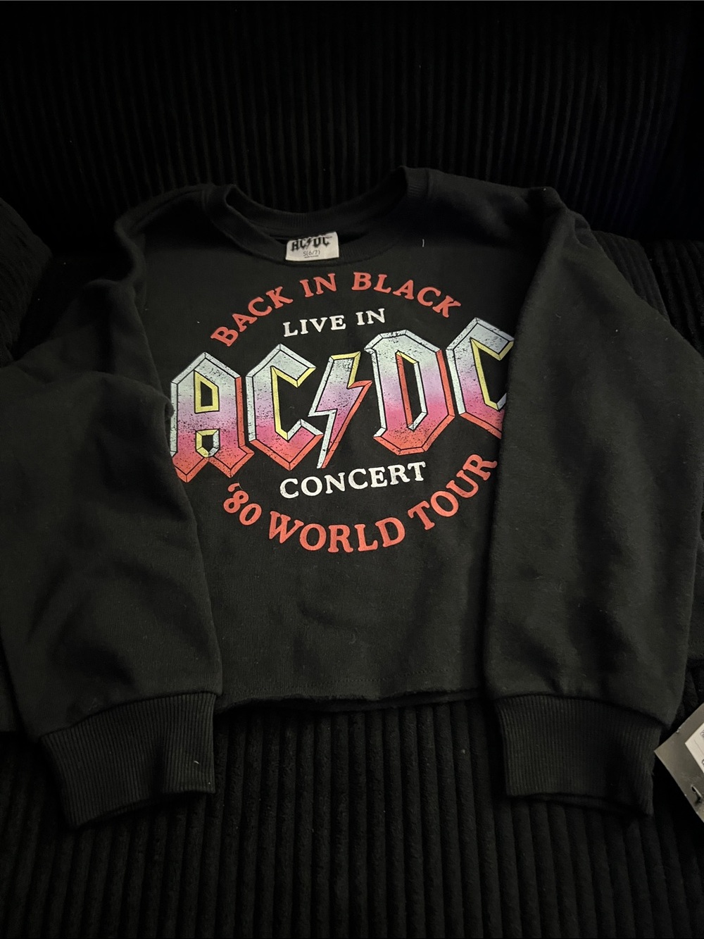 Size 6/7. AC/DC Black Kids Sweatshirt with Gradient Pink-Red Logo